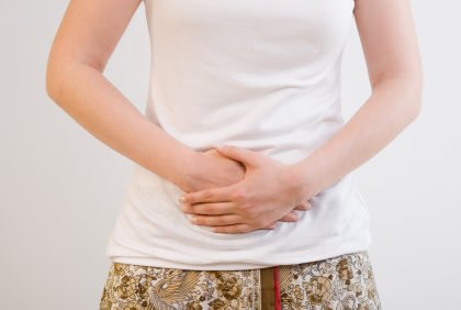 hands on tummy illustrating pain