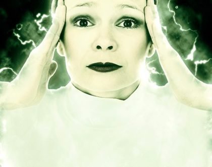 lady holding her temples to portray pain of migraines