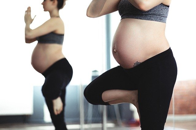 pregnant lady doing yoga