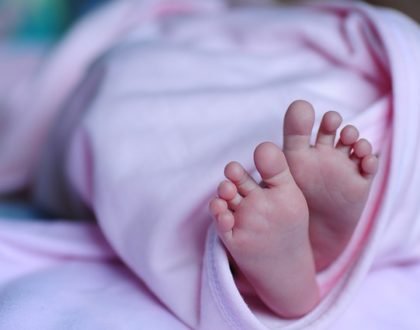 baby feet under cover