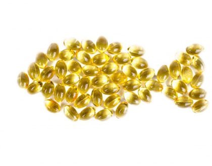 fish oil pills arranged in the shape of a fish