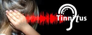 child covering ears due to noise